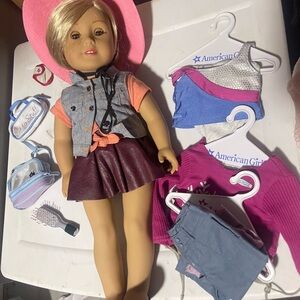 American Girl Doll with Pink Hat and Stylish Outfits